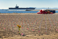 The original Arlington West memorial, Santa Barbara, California; the USS Ronald Reagan is in the background.