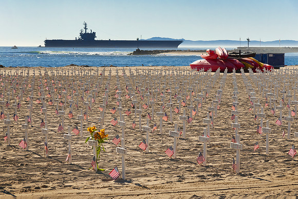 The original Arlington West memorial, Santa Barbara, California; the USS Ronald Reagan is in the background.
